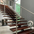 Steel stair with timber treads and steal wire cable balustrade